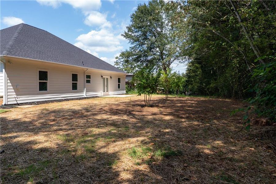 Front exterior of a new home in , Lithonia, GA, highlighting curb appeal (Image 1).