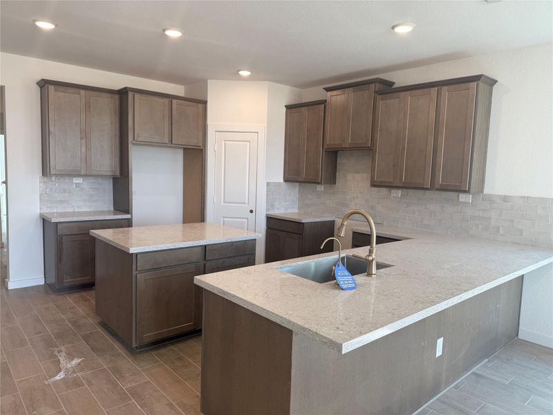 Stunning kitchen with an island with tons of cabinets and counter space. Stainless Steel built-in appliances will be included. Stunning kitchen with an island with tons of cabinets and counter space. Stainless Steel built-in appliances will be included.