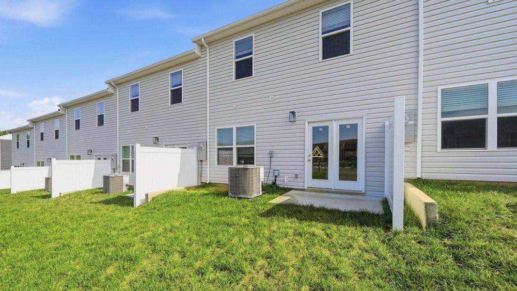 Exterior details and patio area of a home in The Arbor Townhomes, Kingsport (Image 4).