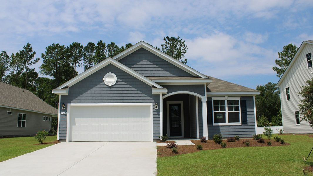 Representative exterior photo of a completed home built from the EATON by D.R. Horton in The Bluffs at Mill Creek, Florence, SC (Image 1).