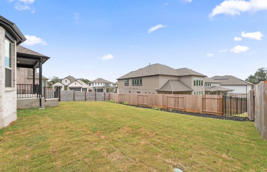 Exterior details and patio area of a home in Bluffview Reserve, Leander (Image 27).