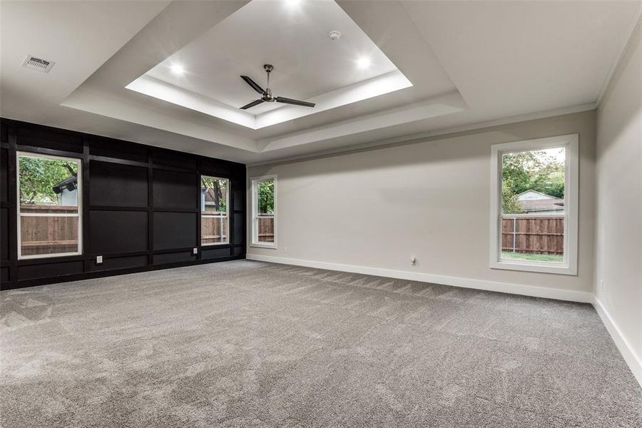 Massif Master bedroom with Accent Walls, Double Tray Ceilings, Shelves and French doors to a Massif Master bedroom that has a free standing tub and his and her separate walk-in-closets!!!