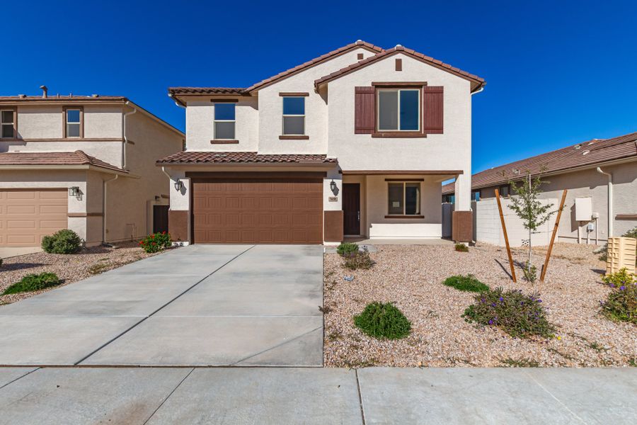 Front exterior of a new home in Wildera, San Tan Valley, AZ, highlighting curb appeal (Image 1). Front exterior of a new home in Wildera, San Tan Valley, AZ, highlighting curb appeal (Image 1).