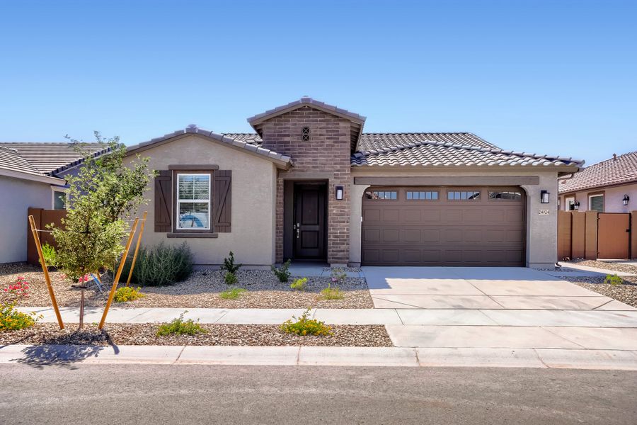 Front exterior of a new home in Asante Artisan, Surprise, AZ, highlighting curb appeal (Image 1). Front exterior of a new home in Asante Artisan, Surprise, AZ, highlighting curb appeal (Image 1).