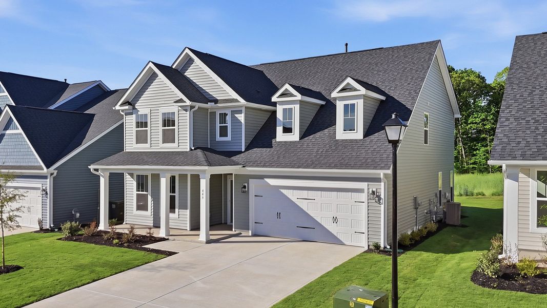 Front exterior of a new home in Harrier Point, Woodruff, SC, highlighting curb appeal (Image 20).