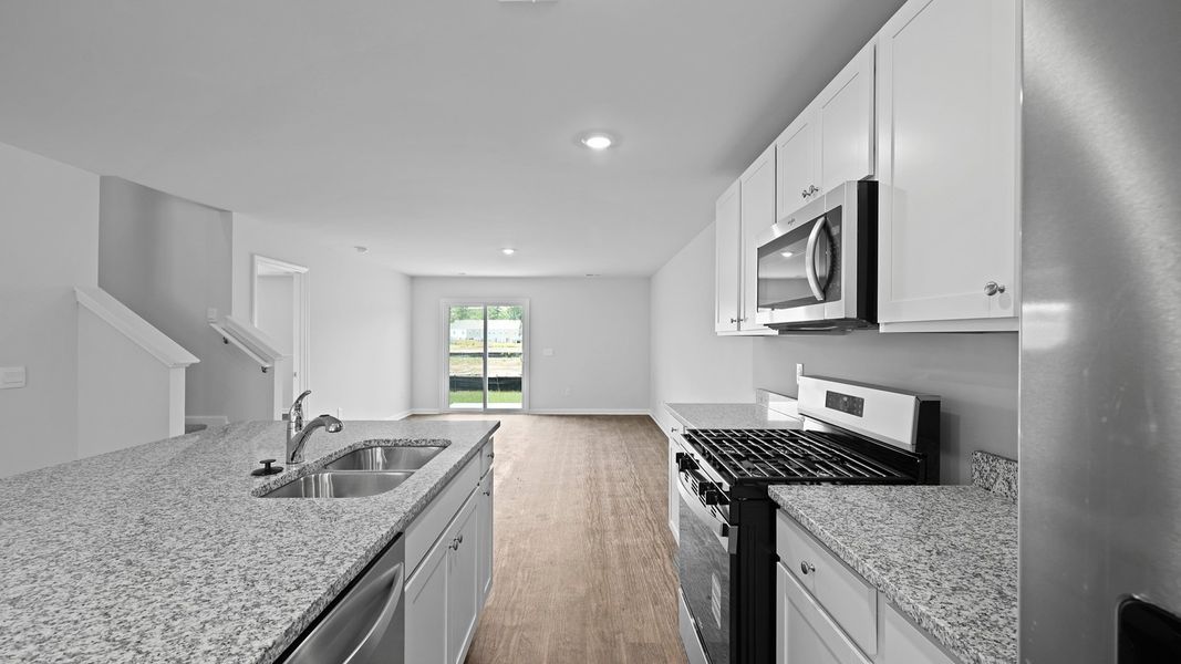 Representative unfurnished interior of a home built from the MURRAY TH by D.R. Horton in Pine Hills Townhomes at Cane Bay, Summerville (Image 13).