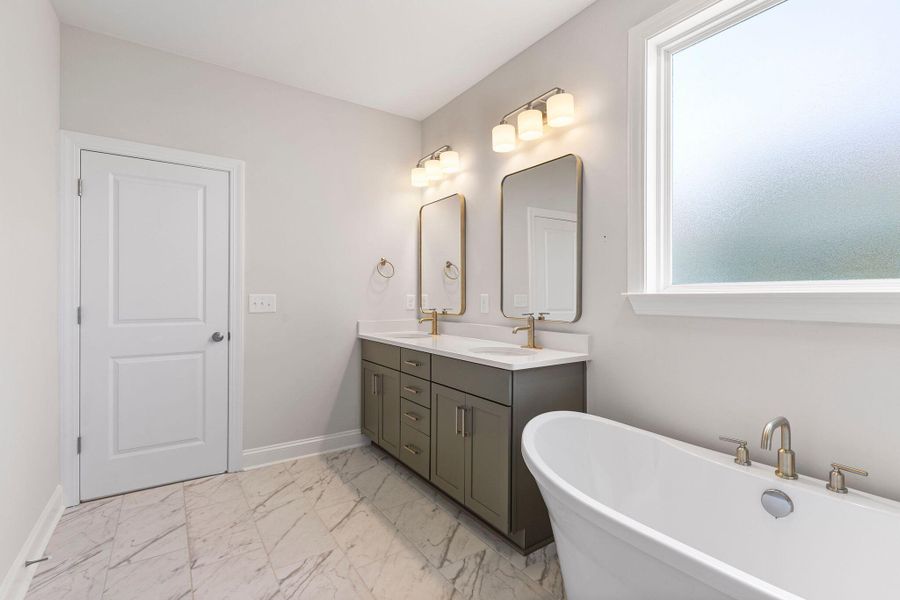 Furnished interior view inside a new home in K. Hovnanian's® Four Seasons at Lakes of Cane Bay, Summerville (Image 7).