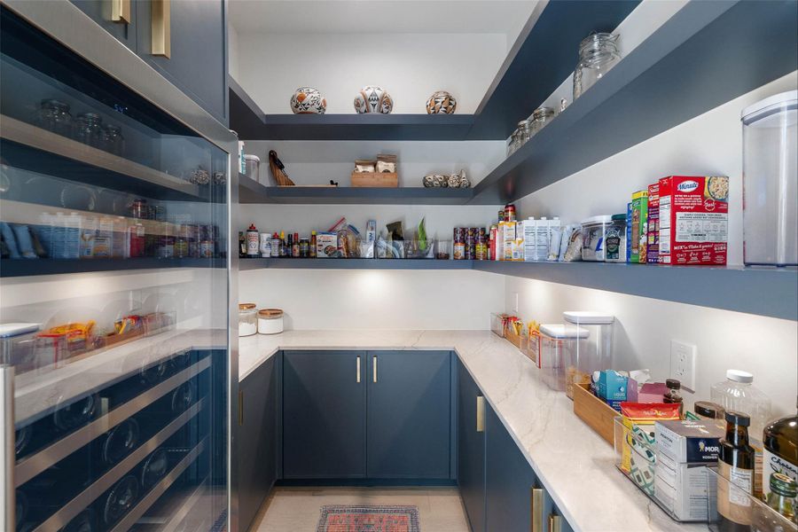 Pantry featuring wine cooler