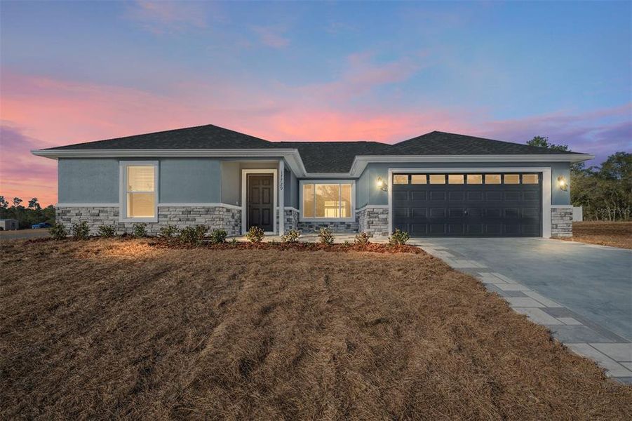 Front exterior of a new home in , Ocklawaha, FL, highlighting curb appeal (Image 17).