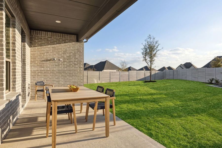 Covered Patio in the Monet II home plan by Trophy Signature Homes – REPRESENTATIVE PHOTO