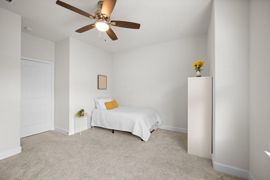 Second view of the front secondary bedroom shows the full layout, closet door, and how easily the room accommodates a full bedroom set. Second view of the front secondary bedroom shows the full layout, closet door, and how easily the room accommodates a full bedroom set.