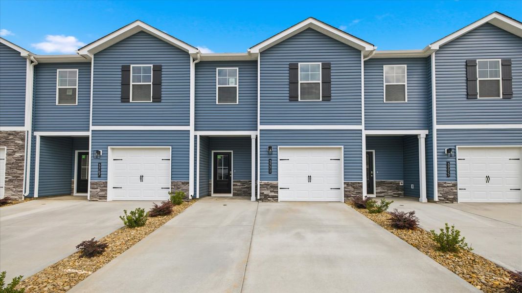 Front exterior of a new home in Cherokee Crossing, Kodak, TN, highlighting curb appeal (Image 1). Front exterior of a new home in Cherokee Crossing, Kodak, TN, highlighting curb appeal (Image 1).