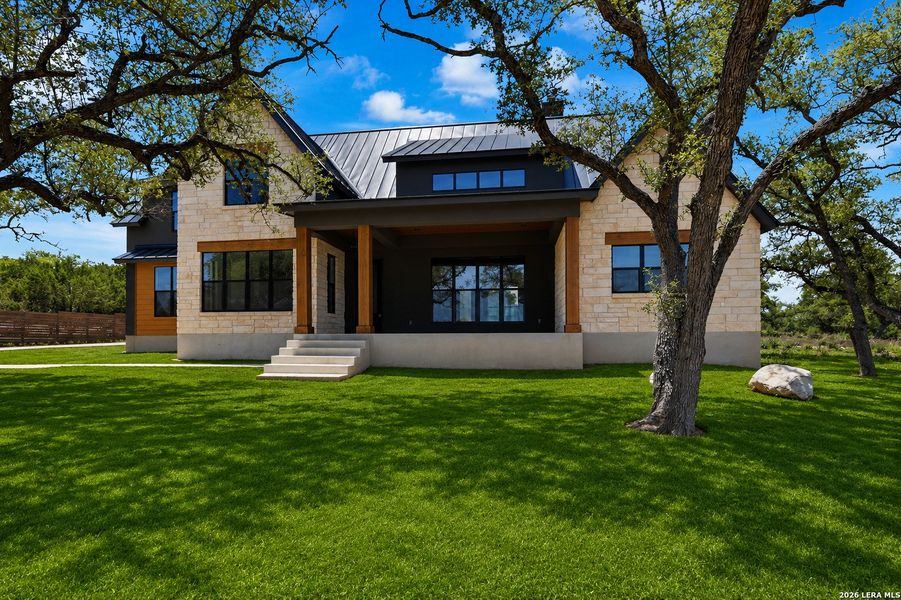 Exterior details and patio area of a home in , Spring Branch (Image 4).