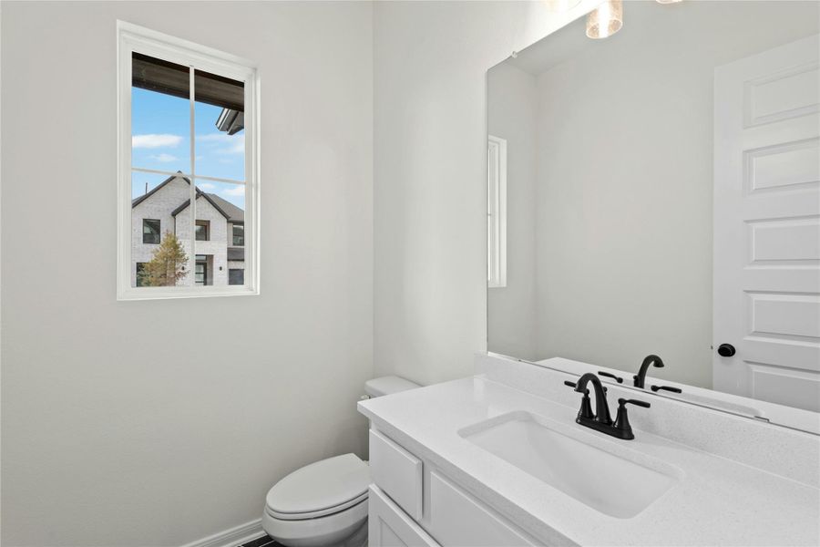 Bathroom featuring vanity and toilet Bathroom featuring vanity and toilet