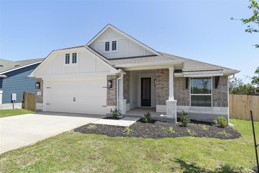 Front exterior of a new home in Grande Estates, Bertram, TX, highlighting curb appeal (Image 22).