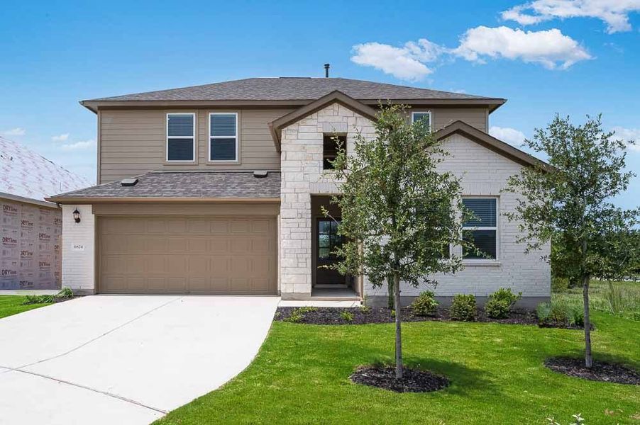 Representative exterior photo of a completed home built from the Sparrow by Taylor Morrison in Turner's Crossing 50s, Austin, TX (Image 1).