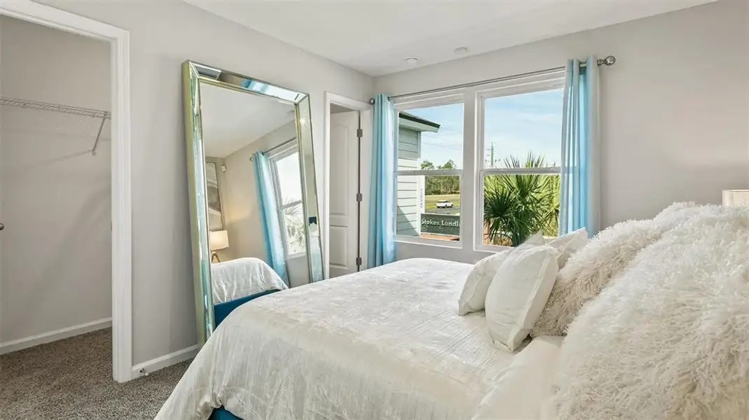 Furnished interior in a model home at Stokes Landing in St. Augustine (Image 7).