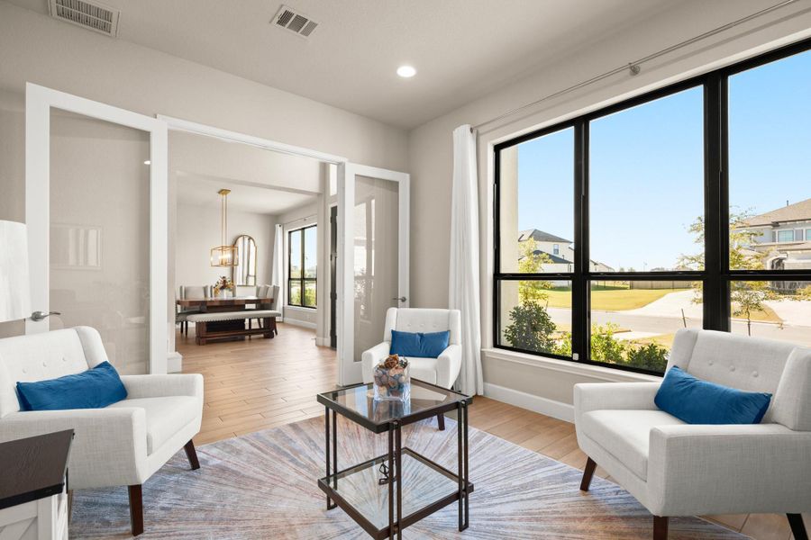 Sitting room with light wood-style flooring, recessed lighting, and a chandelier Sitting room with light wood-style flooring, recessed lighting, and a chandelier