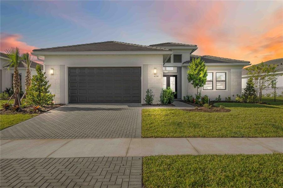 Front exterior of a new home in , Sarasota, FL, highlighting curb appeal (Image 2). Front exterior of a new home in , Sarasota, FL, highlighting curb appeal (Image 2).
