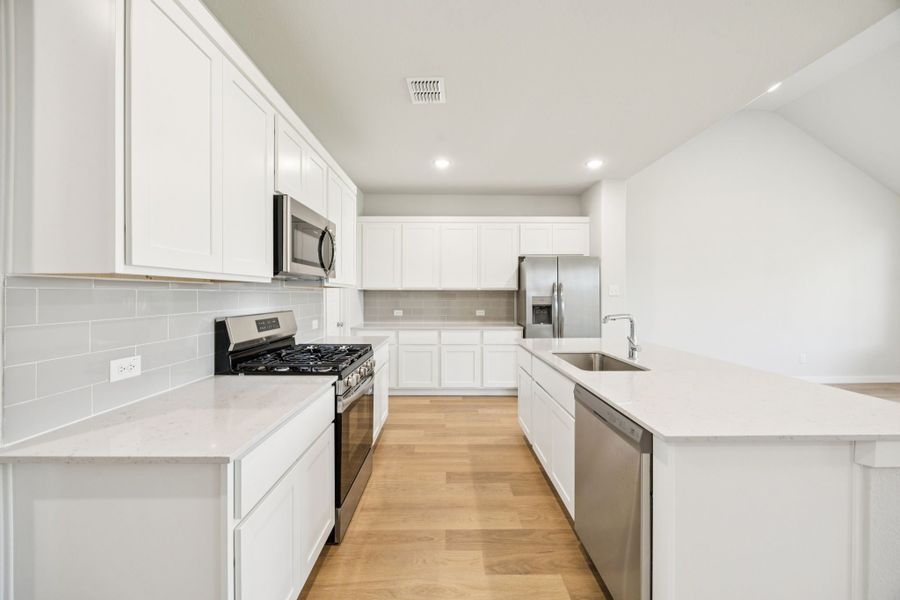 Kitchen in the Masters home plan by Trophy Signature Homes – REPRESENTATIVE PHOTO Kitchen in the Masters home plan by Trophy Signature Homes – REPRESENTATIVE PHOTO