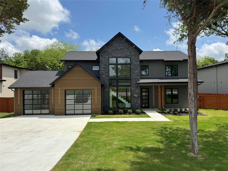 View of front of home featuring a front lawn