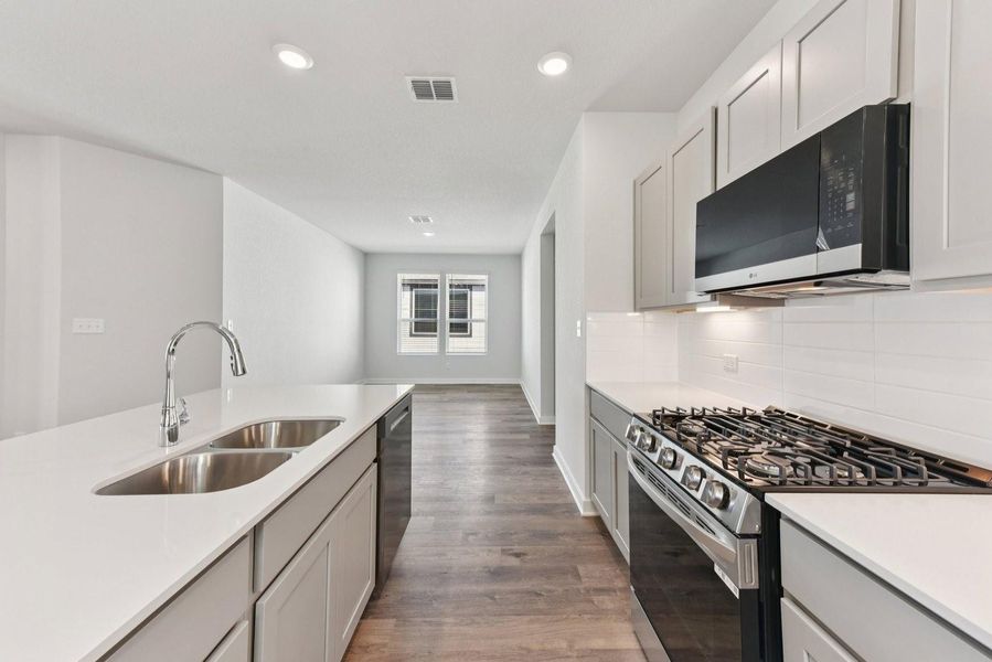 Furnished interior view inside a new home in Stallion Run, Buda (Image 10).