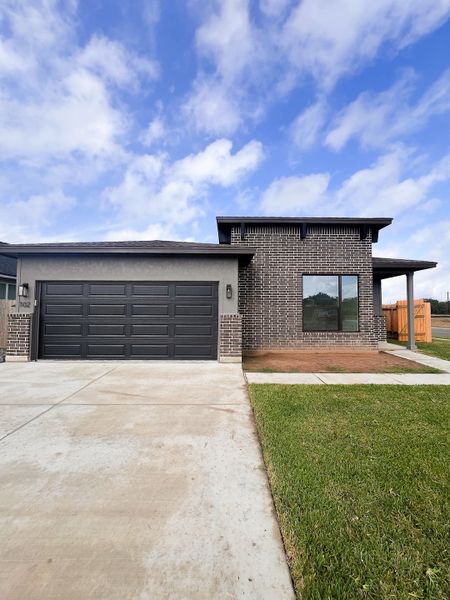 Front exterior of a new home in TerraVista, Victoria, TX, highlighting curb appeal (Image 19).
