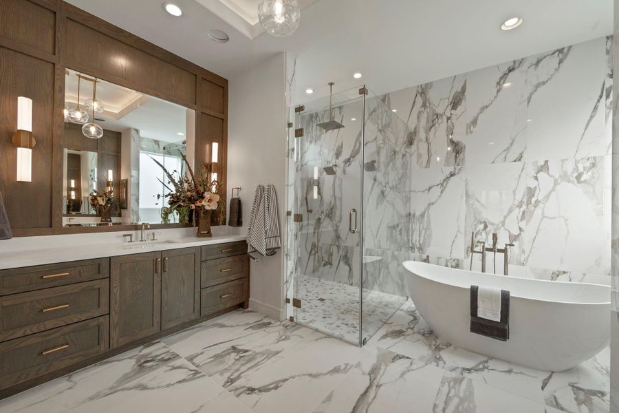 Separate shower with multiple heads and his vanity