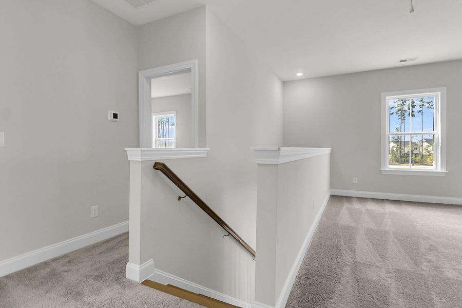 Spacious, unfurnished interior of a new home in Tidewater at Lakes of Cane Bay, Summerville (Image 29).