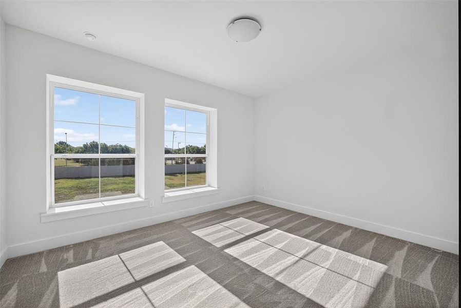 Empty room with light carpet Empty room with light carpet