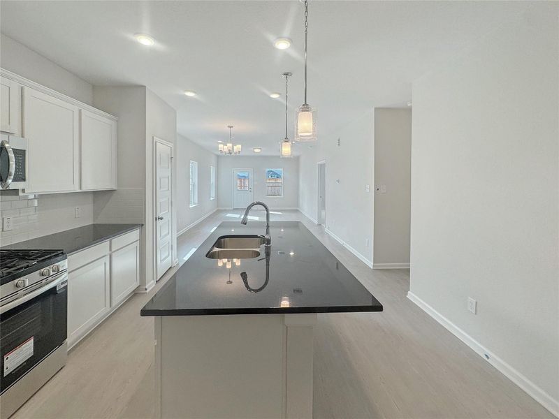 The Piedmont- Kitchen into Dining Area and Family Room