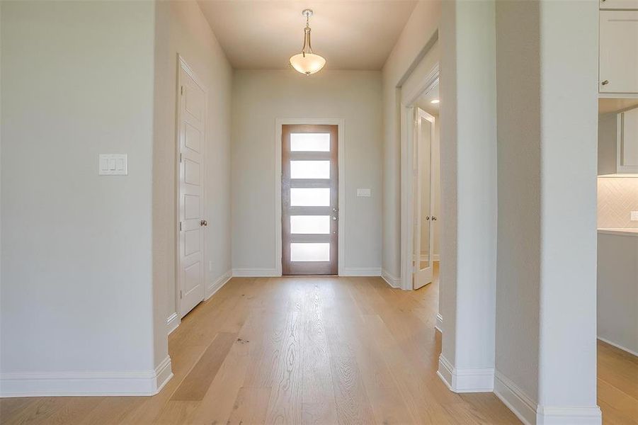 Entryway with light wood-type flooring