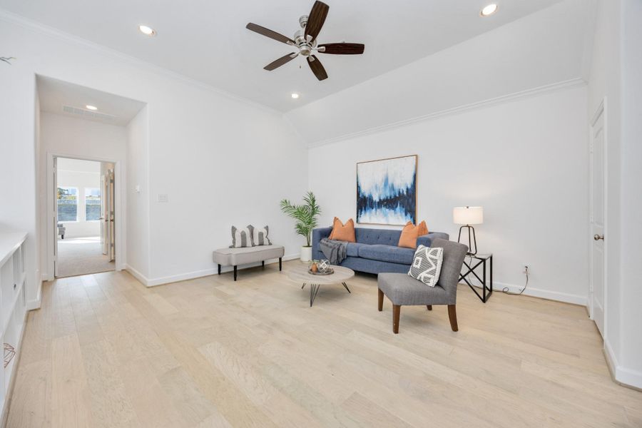 Perched at the top of the stairs, this upstairs lounge is a choose-your-own-adventure space—cozy TV den, home office, or creative corner. The vibe? Totally relaxed.