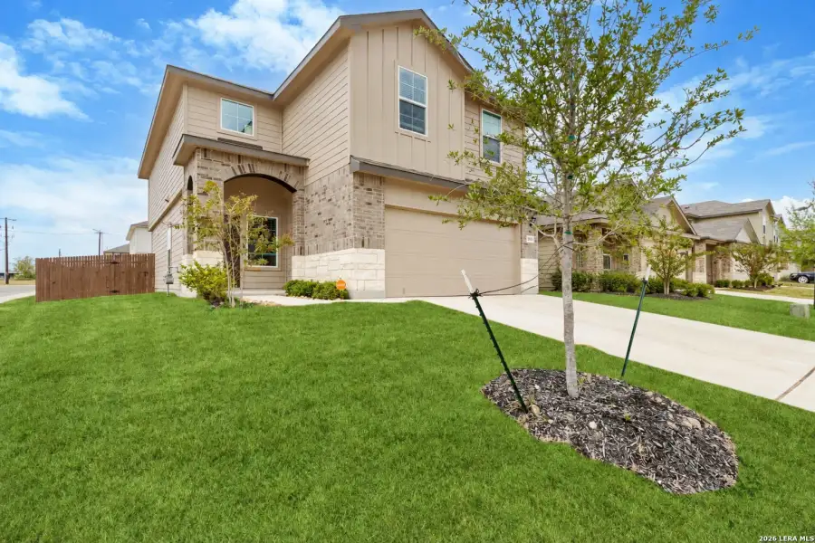 Front exterior of a new home in Avenida, Converse, TX, highlighting curb appeal (Image 22).