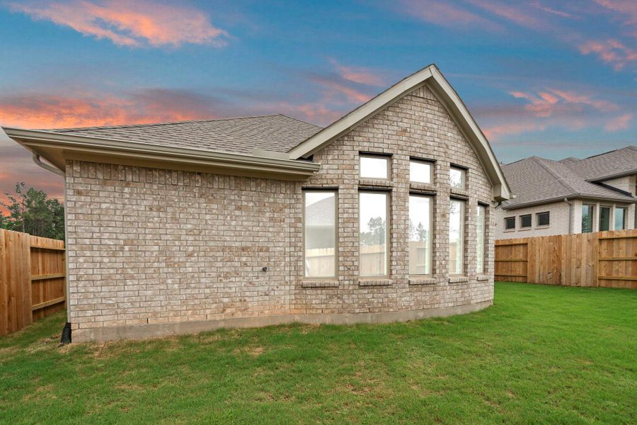 Exterior details and patio area of a home in Wildtree, Magnolia (Image 3).