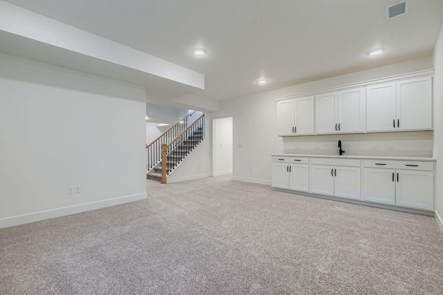 Plan C416 rec room and wet bar representative photo