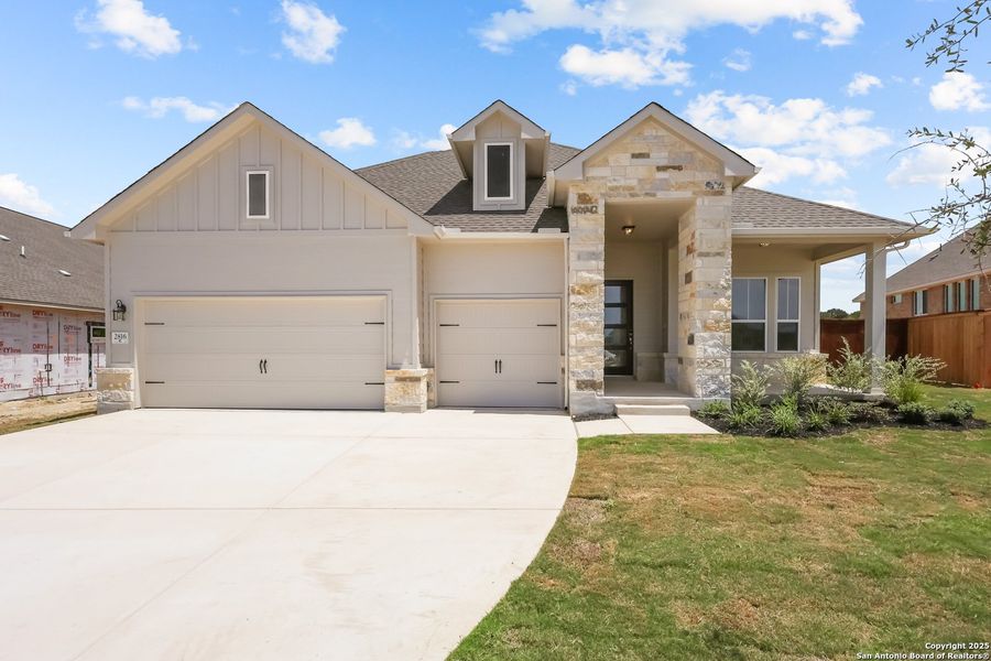 Front exterior of a new home in Homestead, Schertz, TX, highlighting curb appeal (Image 18).