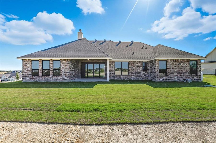 Front exterior of a new home in Eagles Bluff, Willow Park, TX, highlighting curb appeal (Image 1).
