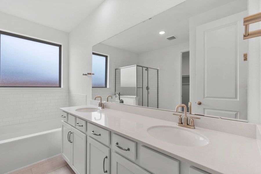 Primary bathroom.  Sample product photo. Actual exterior and interior selections may vary by homesite. Photo may be virtually staged.