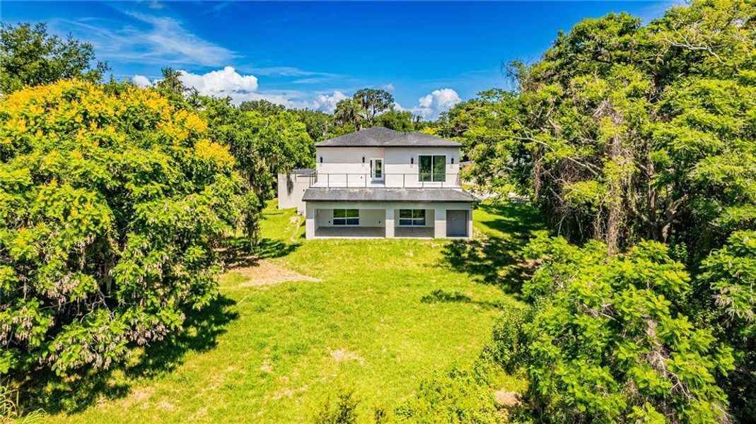 Front exterior of a new home in , Windermere, FL, highlighting curb appeal (Image 1).