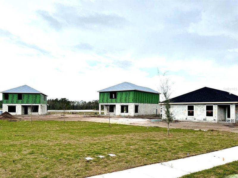 Front exterior of a new home in , St. Cloud, FL, highlighting curb appeal (Image 7).