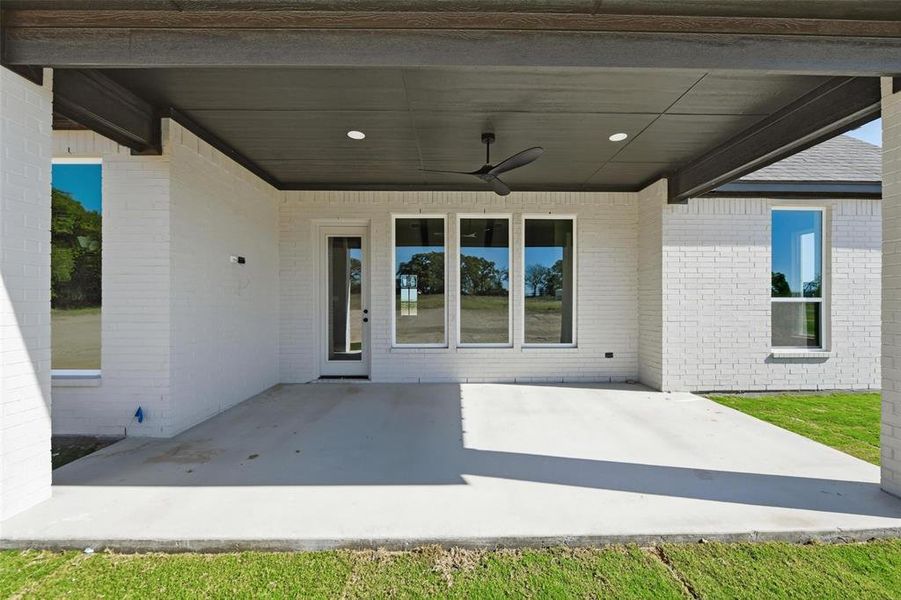 Exterior details and patio area of a home in , Poolville (Image 3).