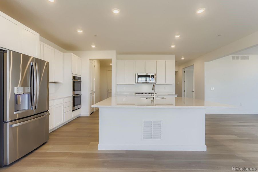 Furnished interior view inside a new home in Sunset Village: The Grand Collection, Erie (Image 5).
