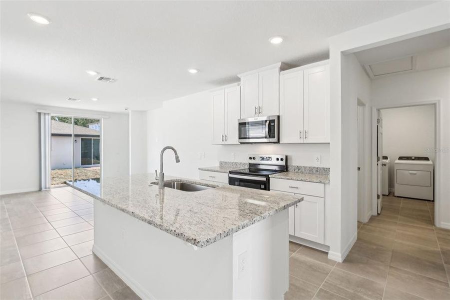 Furnished interior view inside a new home in Villamar - Classic Series, Winter Haven (Image 4). Furnished interior view inside a new home in Villamar - Classic Series, Winter Haven (Image 4).