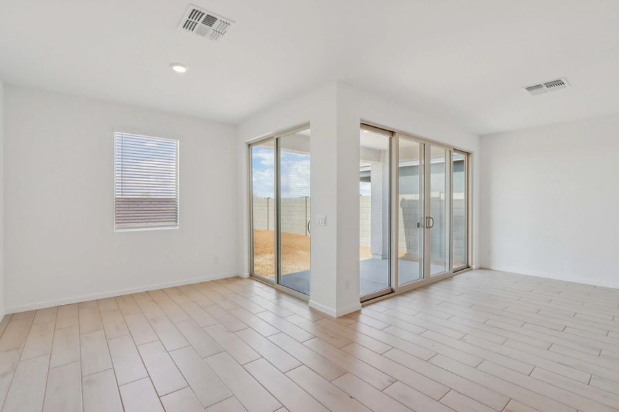 Dining and great room with upgraded 4 panel slider. Finishes and options may vary by community. Dining and great room with upgraded 4 panel slider. Finishes and options may vary by community.