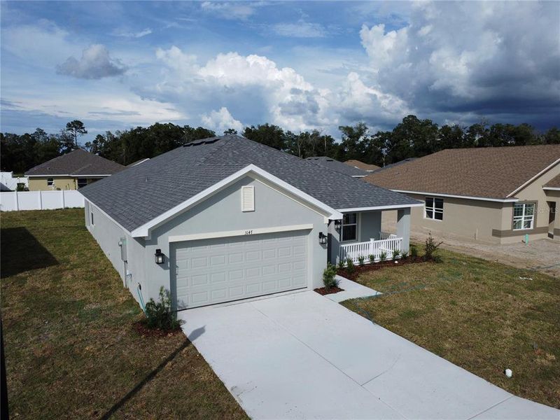 Front exterior of a new home in , Ocala, FL, highlighting curb appeal (Image 14). Front exterior of a new home in , Ocala, FL, highlighting curb appeal (Image 14).