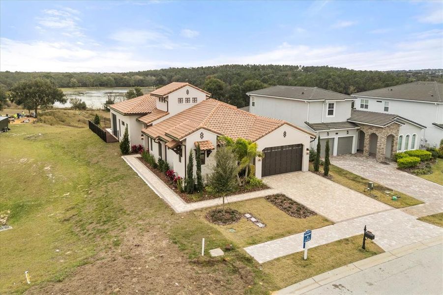 Front exterior of a new home in , Montverde, FL, highlighting curb appeal (Image 24).
