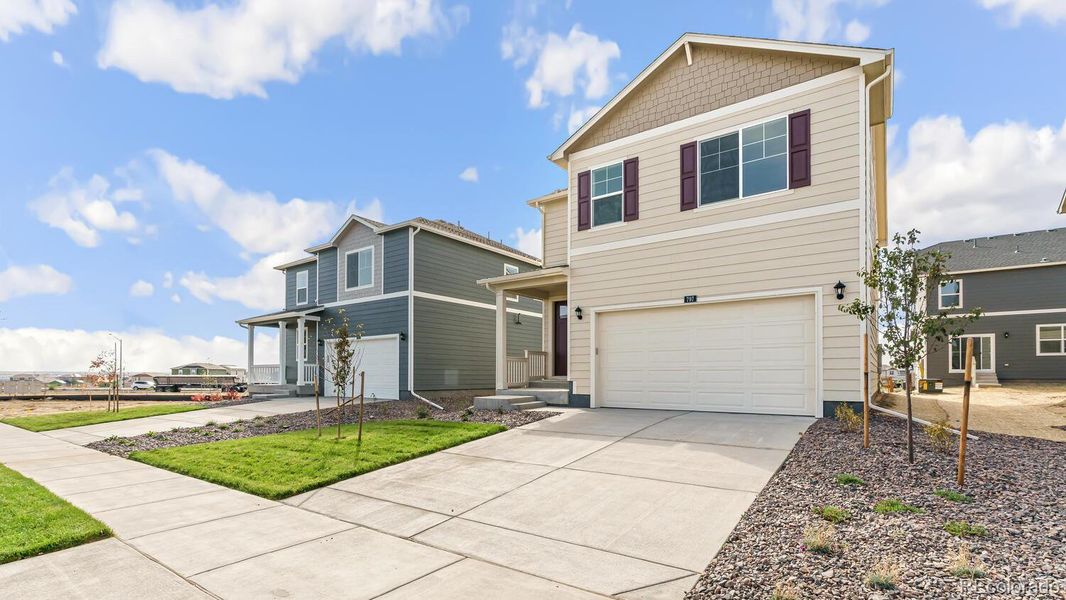 Front exterior of a new home in Prairie Song, Windsor, CO, highlighting curb appeal (Image 20).