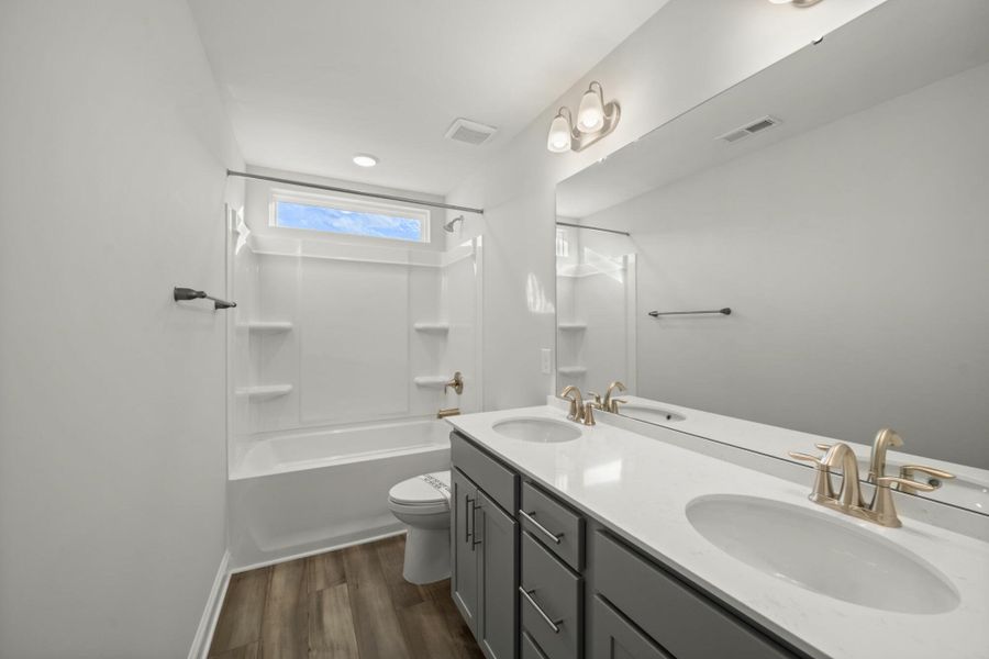 Furnished interior view inside a new home in Cottages at Piper Village, Trinity (Image 12).