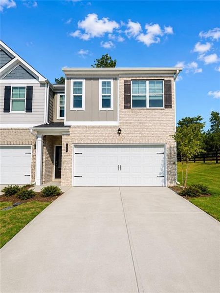 Front exterior of a new home in Lake Harbin, Morrow, GA, highlighting curb appeal (Image 2). Front exterior of a new home in Lake Harbin, Morrow, GA, highlighting curb appeal (Image 2).